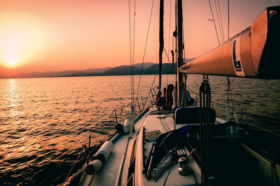 Using Boat Rental Software, sailing into the sunset on a calm sea. | kleesto